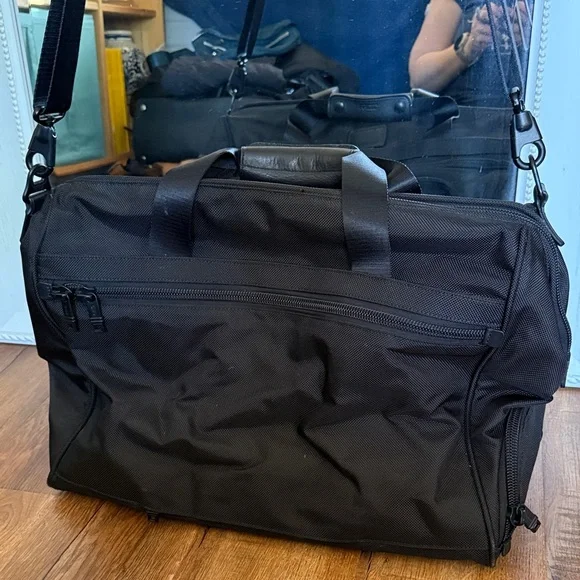 Tumi black travel bag/carryon